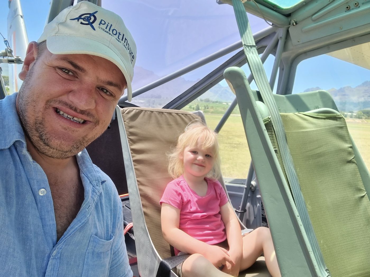 Franz Smit, founder of PilotInsure, with his daughter in a light aircraft