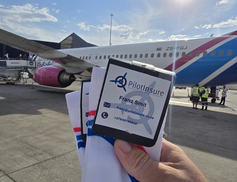 PilotInsure branded socks handed to a FlySafair pilot on the tarmac